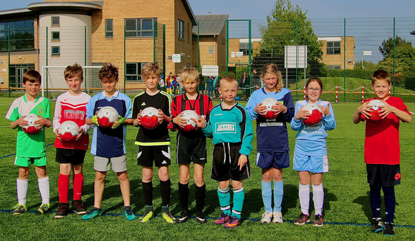 Captains pose with Fairtrade footballs
